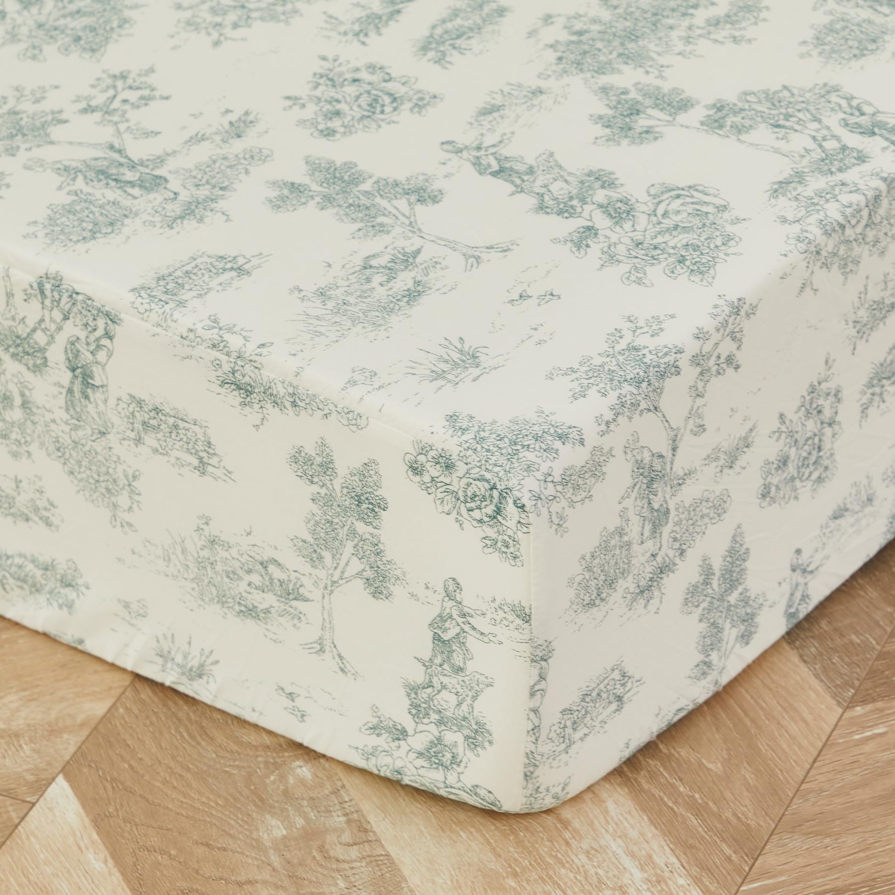 Brandream toile crib sheet closeup highlights breathable 100% cotton surface for baby comfort.