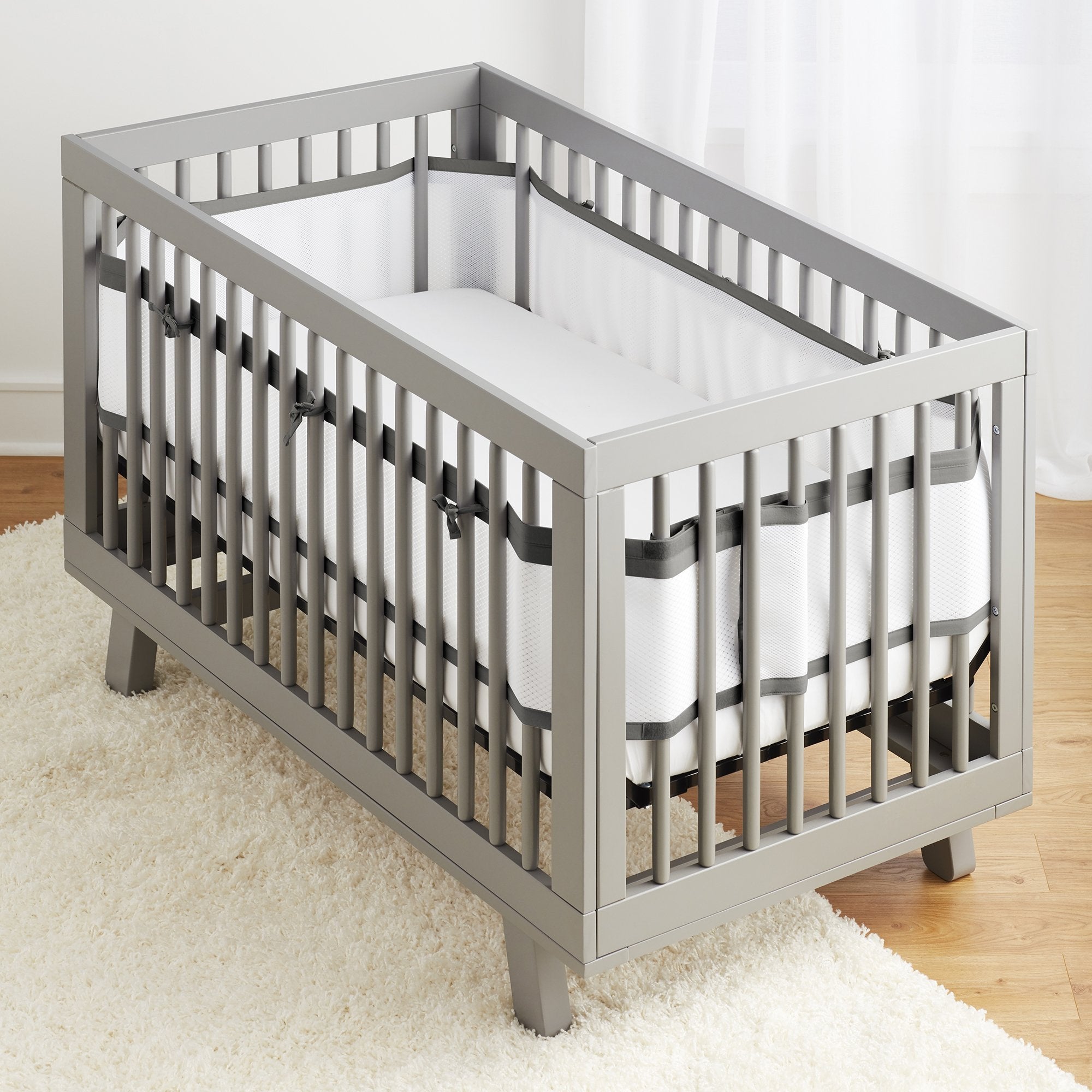BreathableBaby breathable-mesh-liner-crib-charcoal demonstrates full-coverage fit with improved airflow.