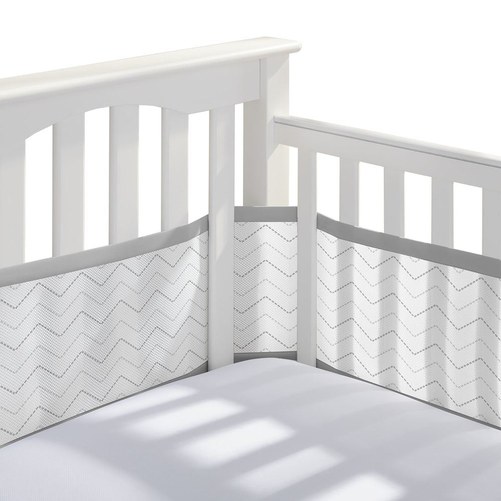 BreathableBaby full-size crib liner in gray chevron shows four-sides coverage and airflow