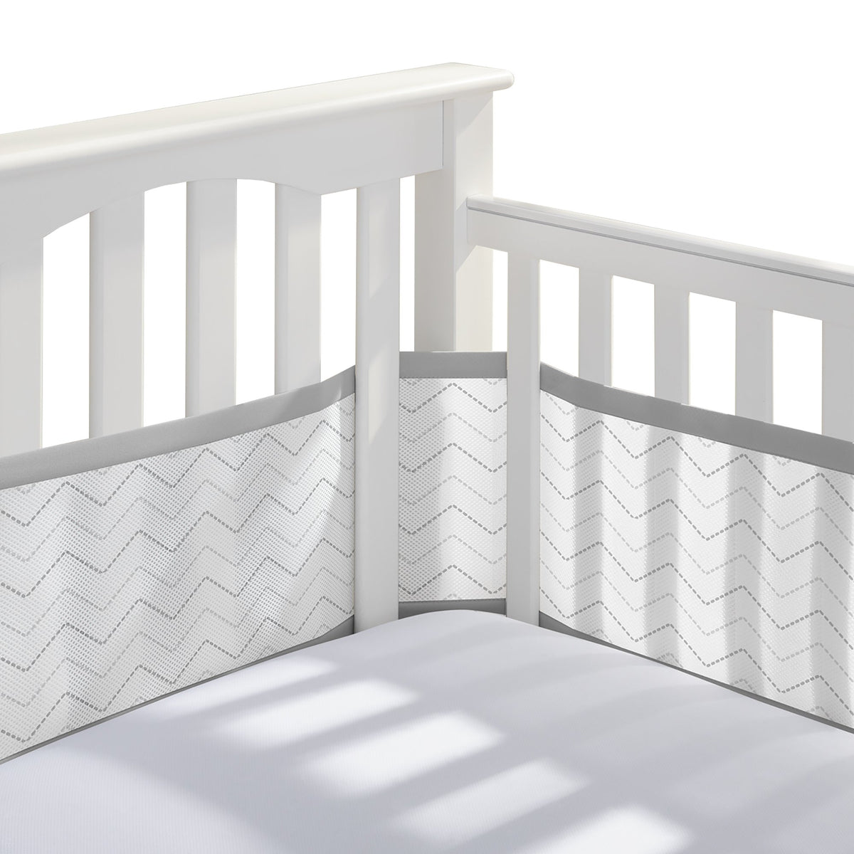 BreathableBaby full-size crib liner in gray chevron shows four-sides coverage and airflow
