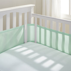 BreathableBaby breathable mesh liner on full-size crib, mint green, four-sided coverage for safe sleep.