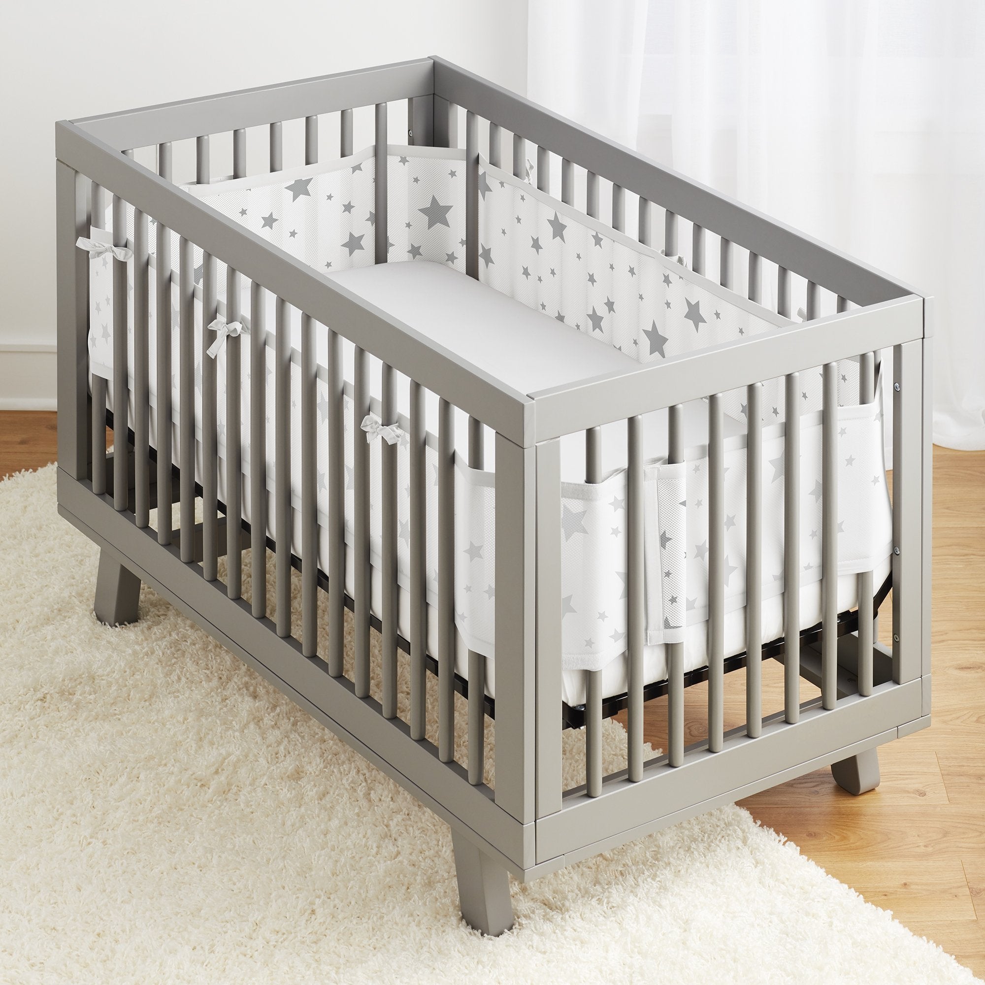 BreathableBaby mesh liner Starlight panel assembly demonstrates flexible crib coverage.