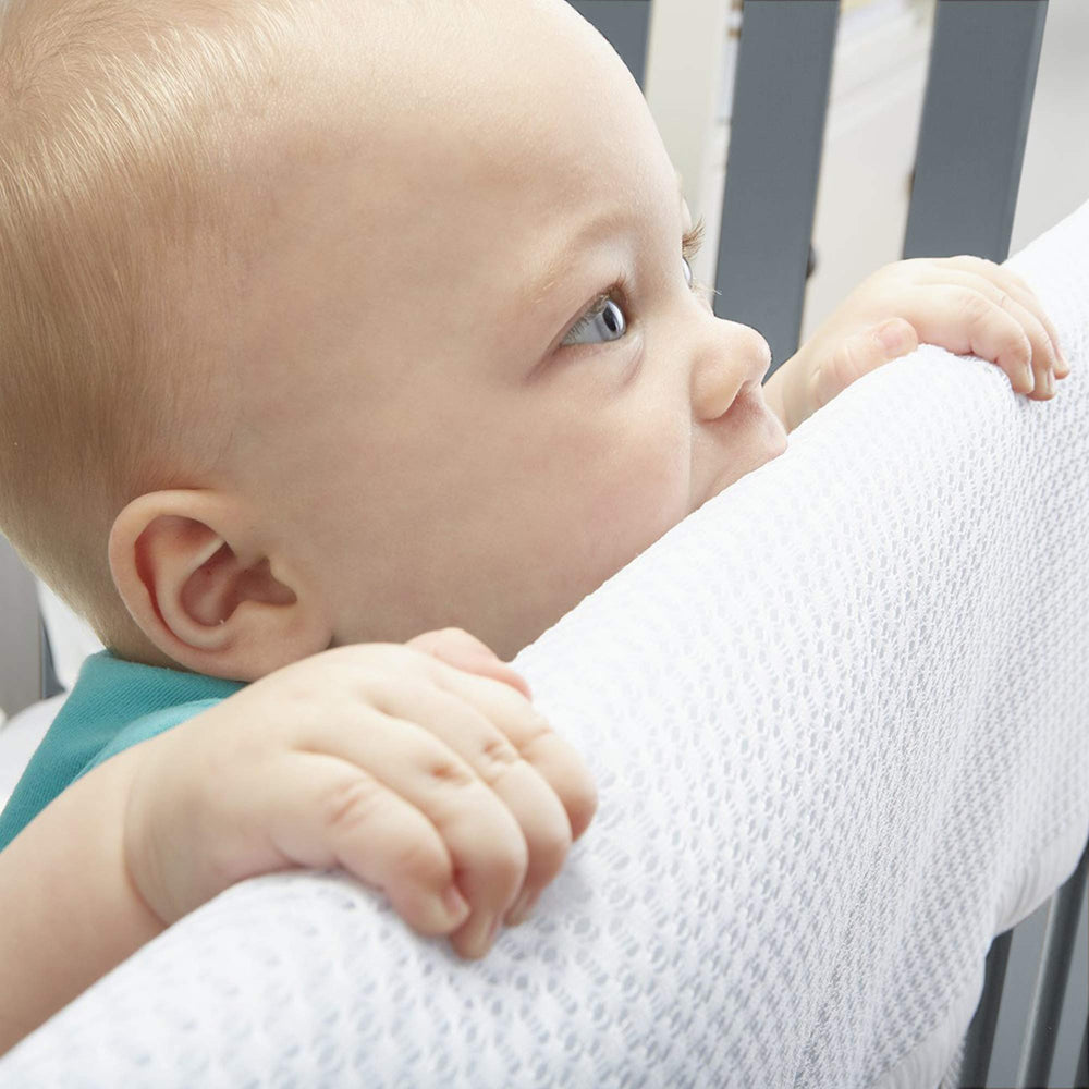 BreathableBaby rail cover closeup shows air-channel mesh for comfortable teething protection.
