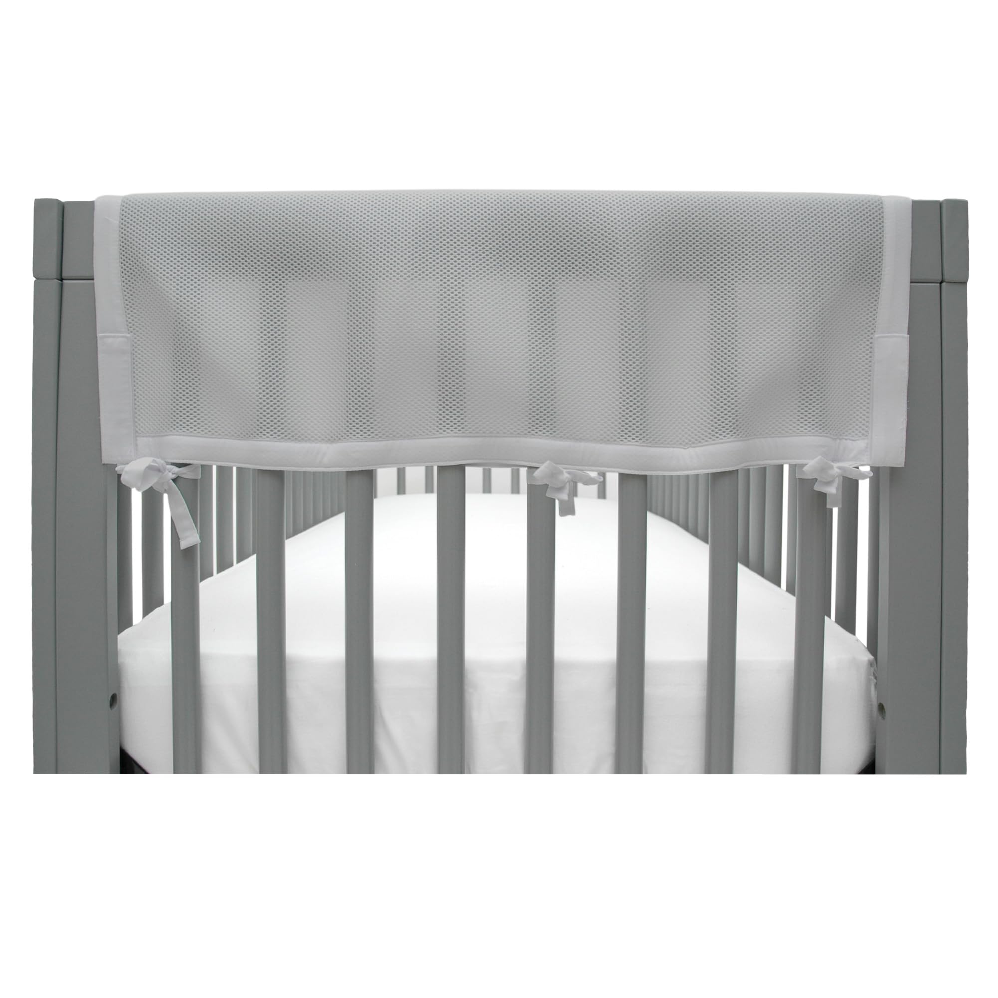 BreathableBaby RailGuard attached to crib rail in gray for teething protection
