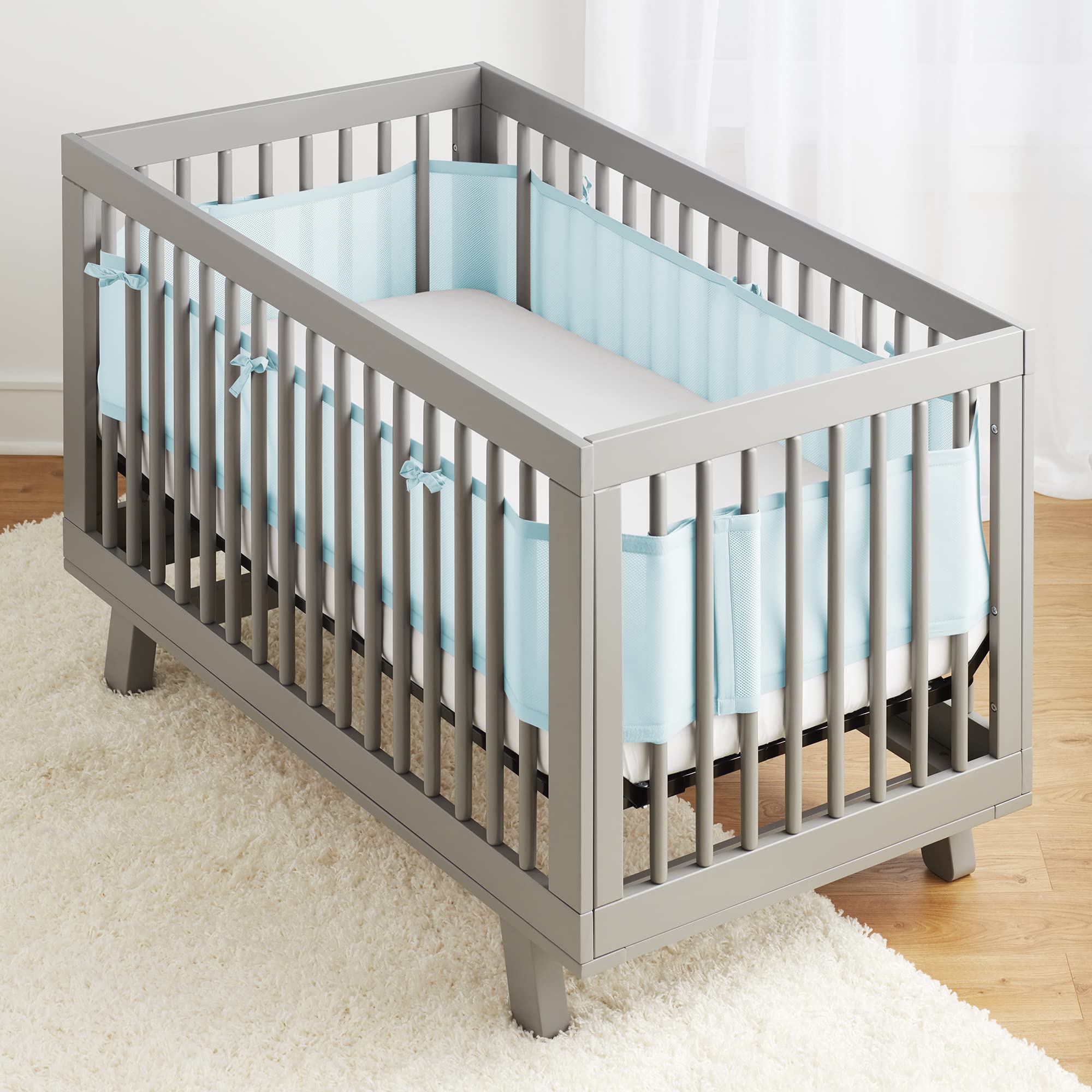 BreathableBaby crib liner coverage on four sides demonstrates complete guard for the mattress.