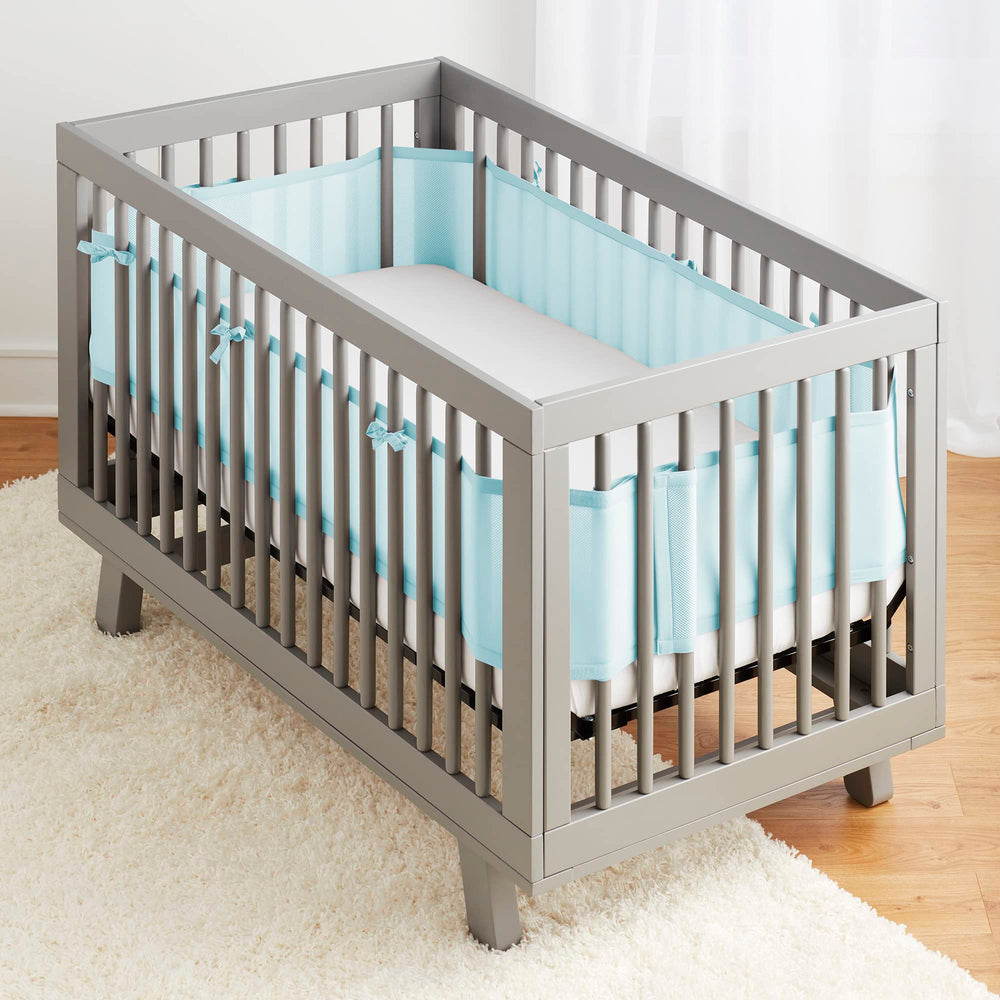 BreathableBaby crib liner coverage on four sides demonstrates complete guard for the mattress.