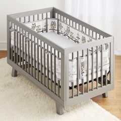 BreathableBaby crib liner installed on four sides demonstrates complete coverage and breathable protection.