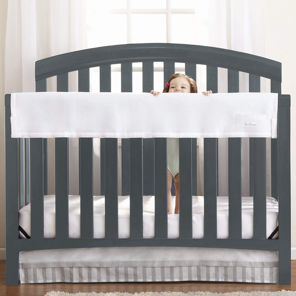 BreathableBaby railguard long panel cover on crib rail for teething protection.