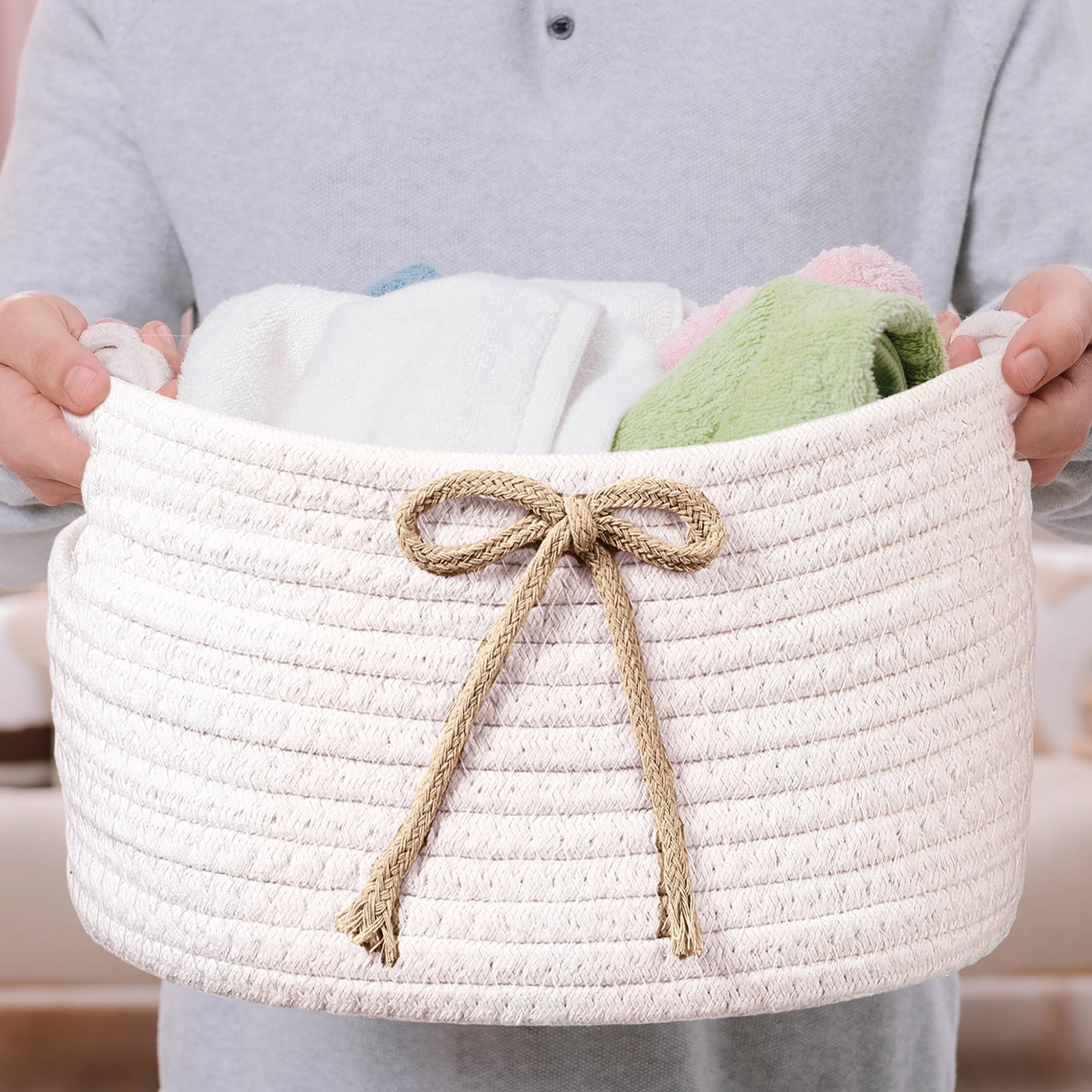 Breling Coquette Bow Storage Basket in nursery room for decor and organization.