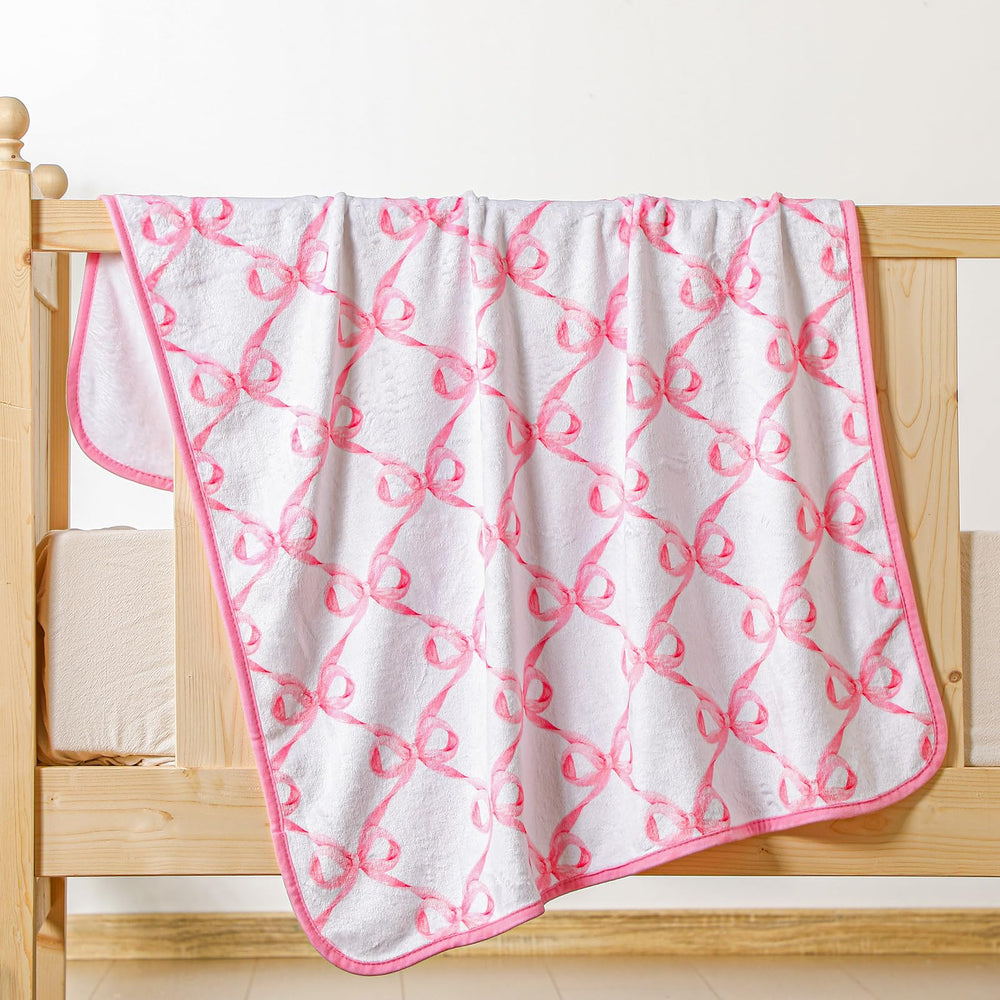 Breling pink bow blanket laid flat for cozy snuggle and photo-ready layout