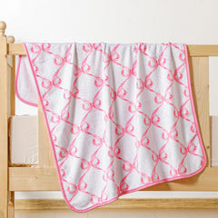 Breling pink bow blanket laid flat for cozy snuggle and photo-ready layout