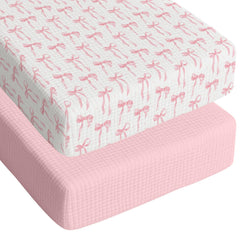 Breling pink bow crib sheet close-up showing soft cotton texture for baby comfort