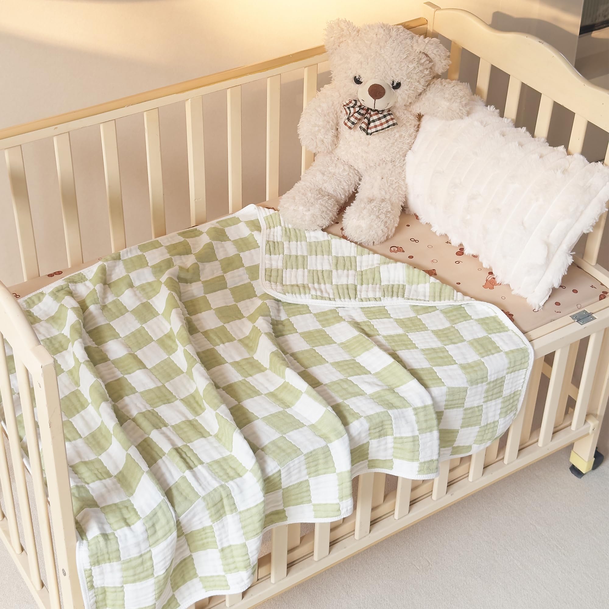 Brnabiou blanket enhances nursery decor with sage green checker look