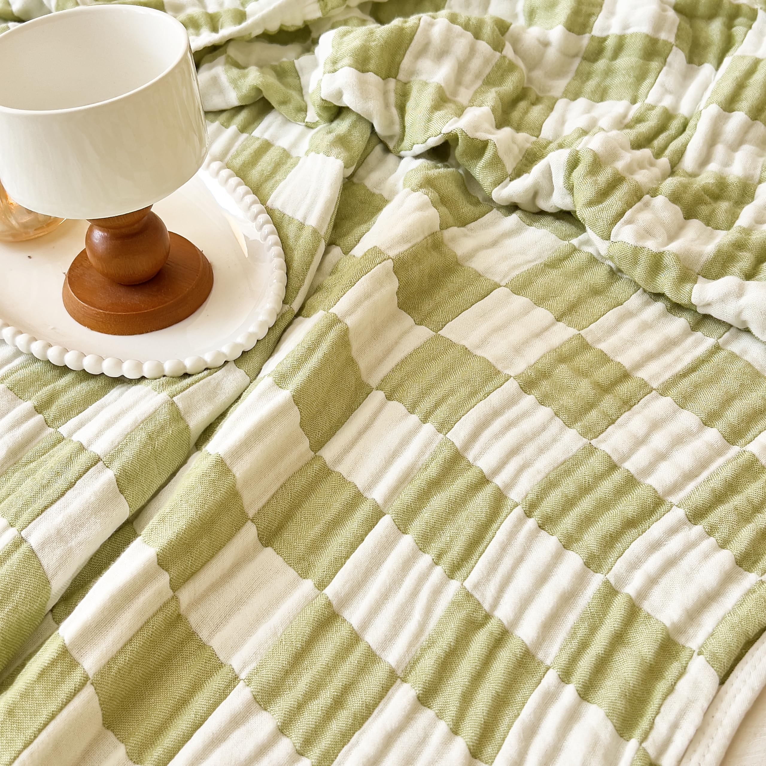 Brnabiou blanket during nap time on tummy time mat in sage green checker