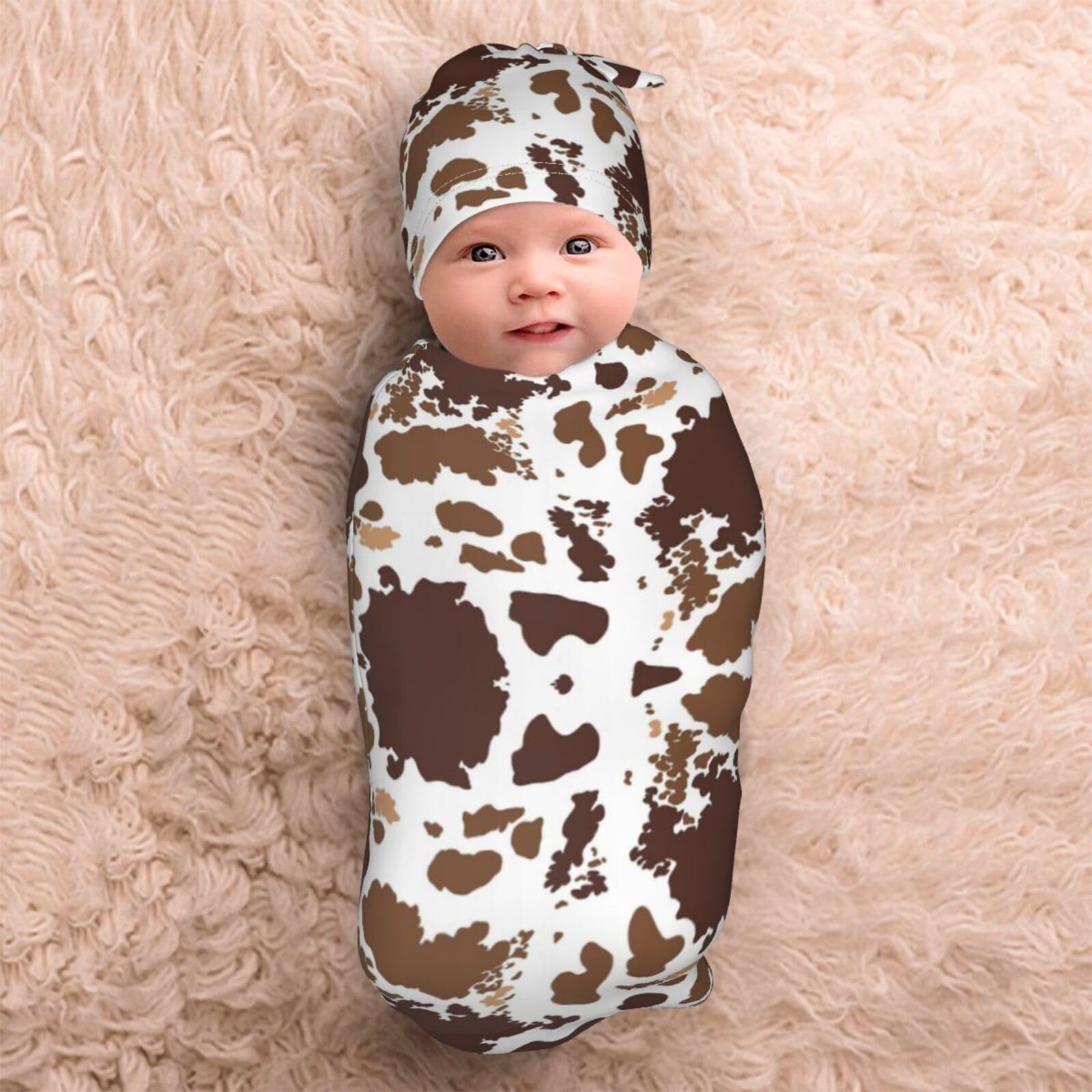 Broiteid cow-print hat provides extra warmth and gentle containment for naps.