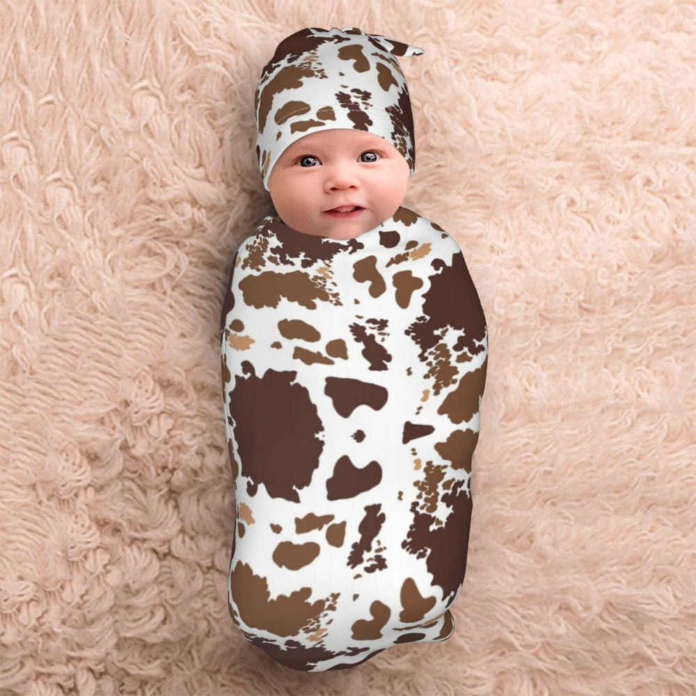 Broiteid cow-print hat provides extra warmth and gentle containment for naps.