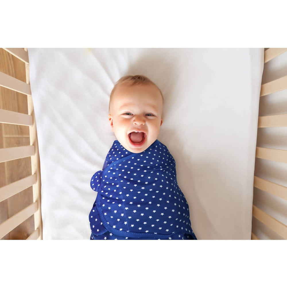 Bubble Bear 3-pack baby swaddle blue on baby promotes snugness and secure sleep.