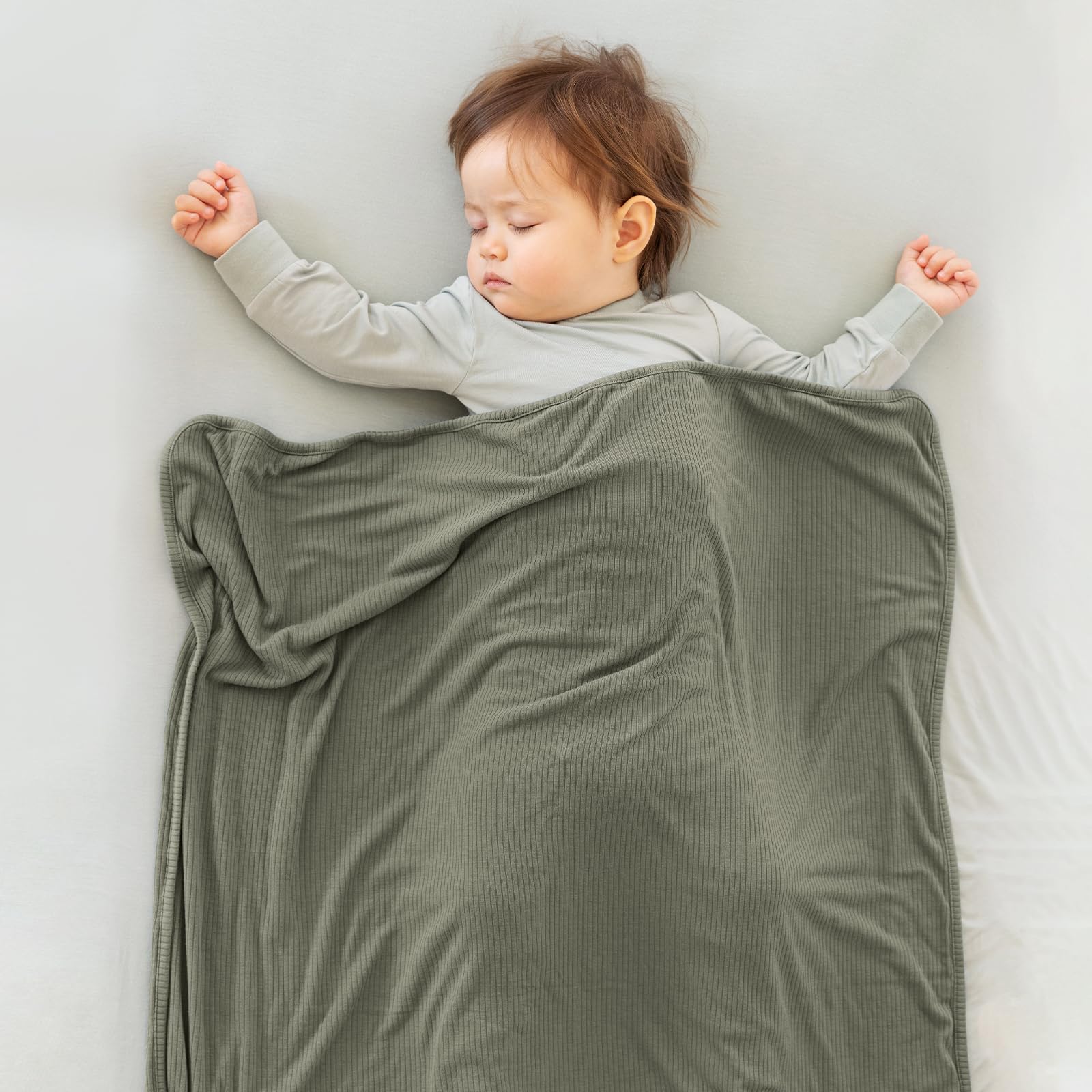 BubblePanda dusty-rose blanket displayed in cozy nursery setting