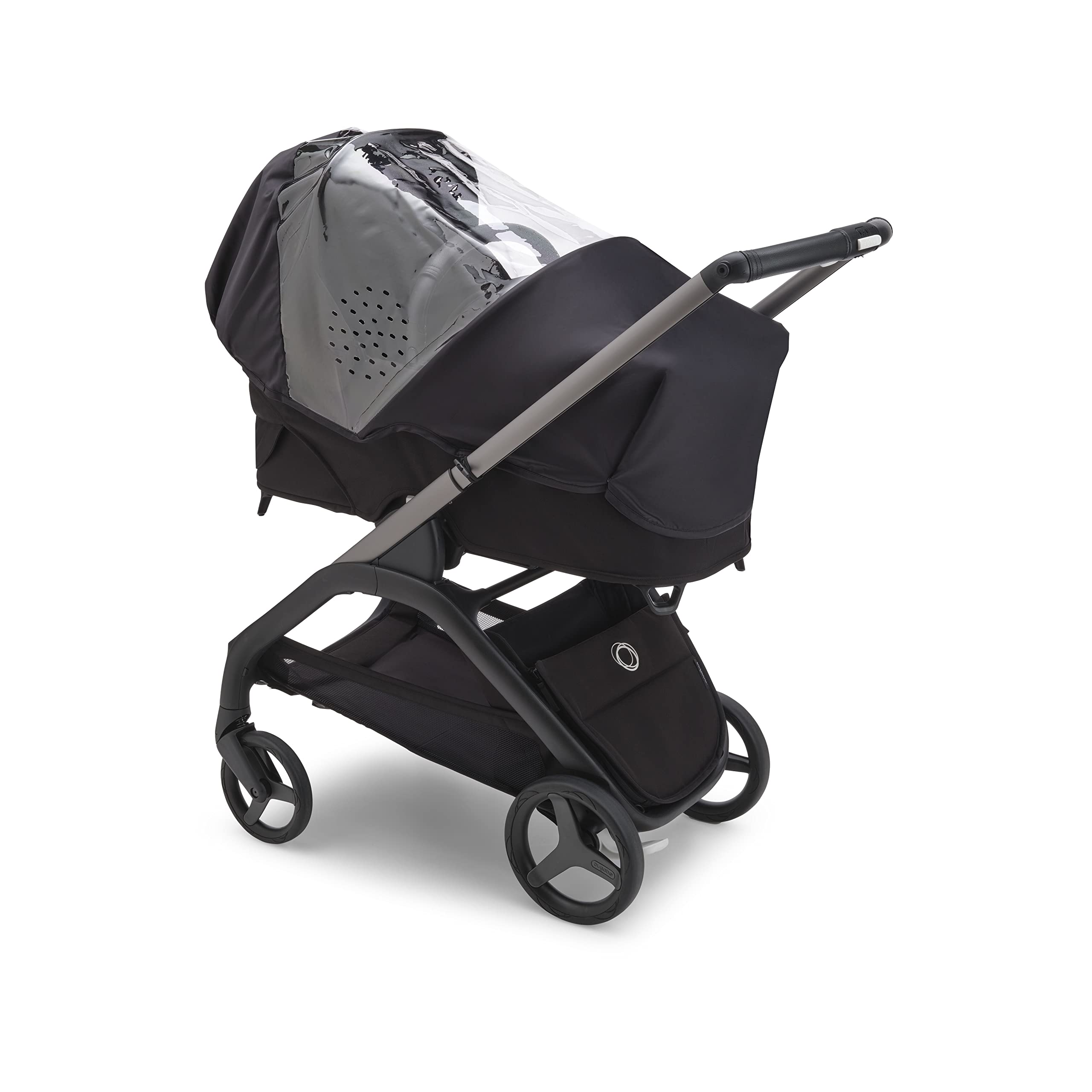 Bugaboo Dragonfly rain cover folded for compact storage in underseat basket.