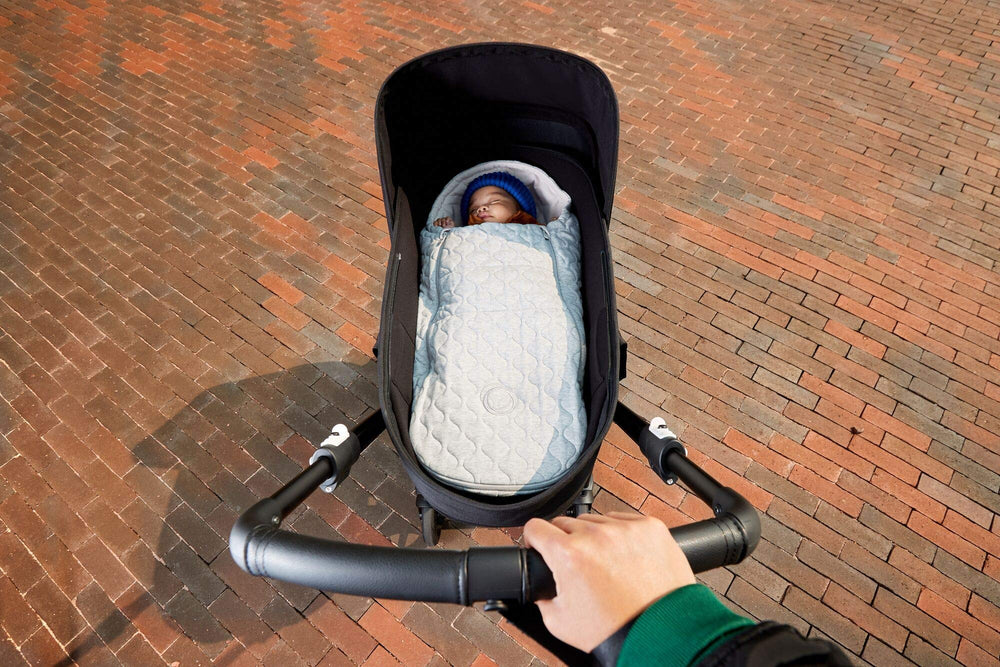 Bugaboo newborn inlay footmuff light grey melange pattern adds modern style.