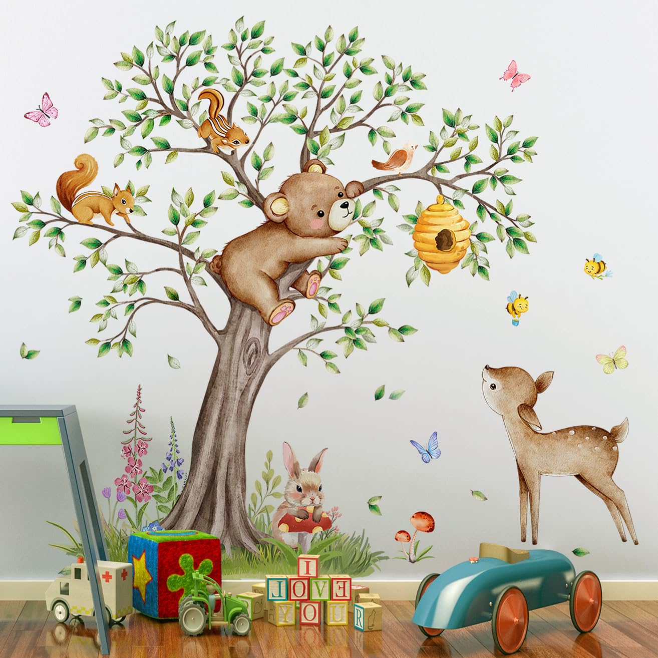 Buiory woodland animals decals assemble into a vibrant playroom forest scene.