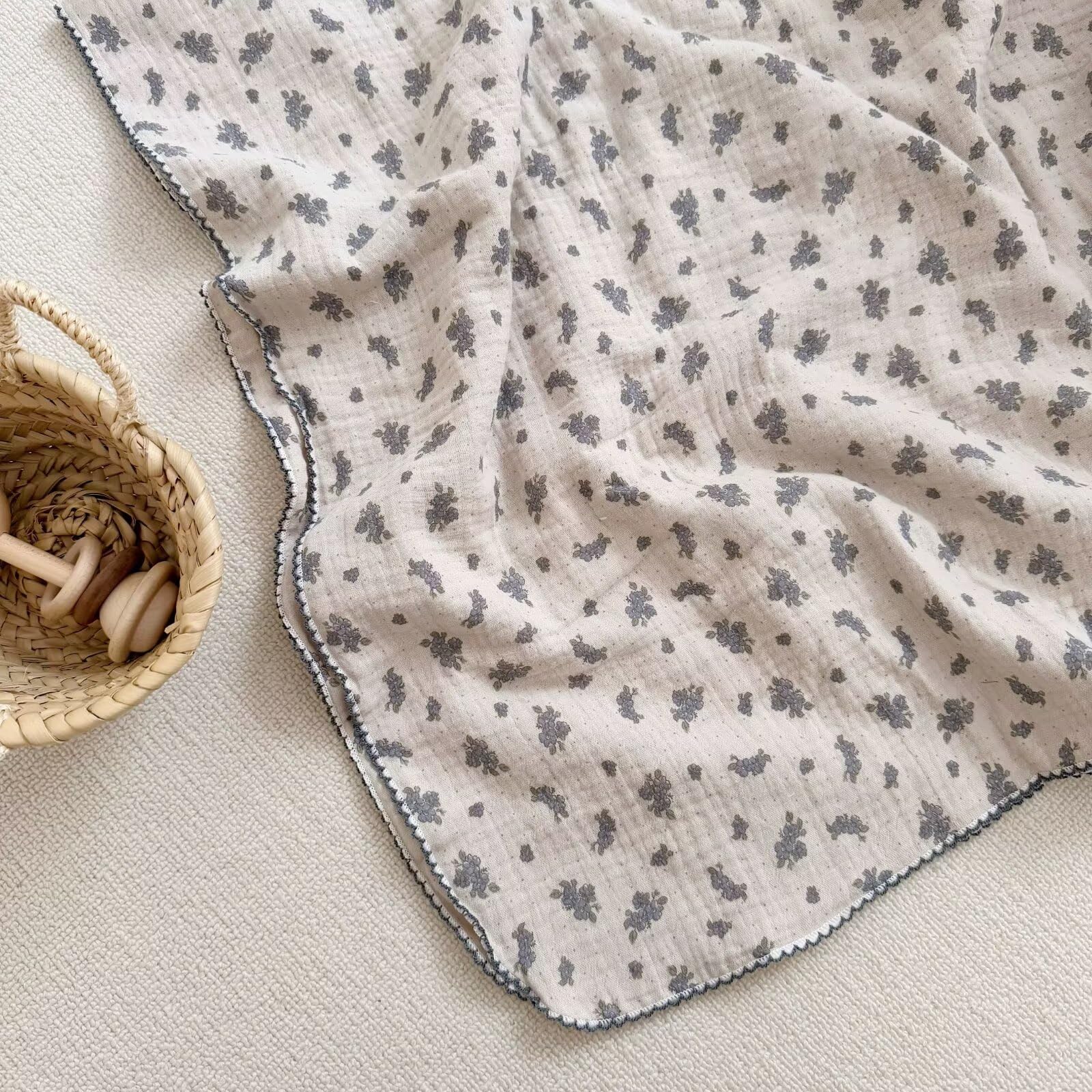BuLuTu 47x51 inch baby blanket laid in a cozy nursery setting.