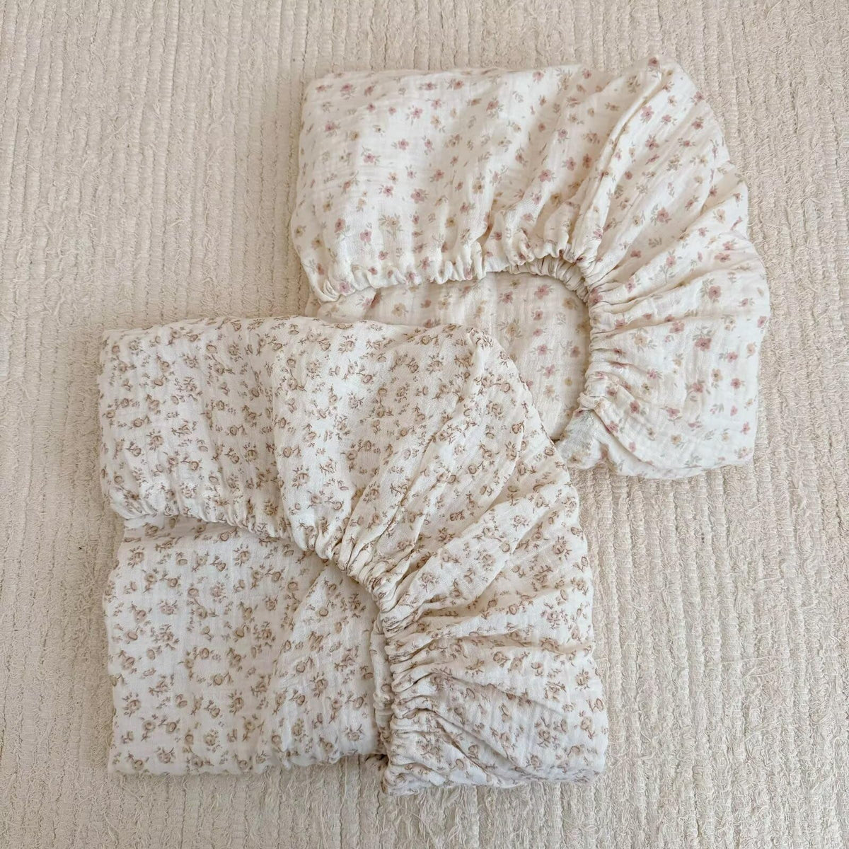 BuLuTu cotton muslin crib sheet close-up shows soft breathable fabric for baby comfort.
