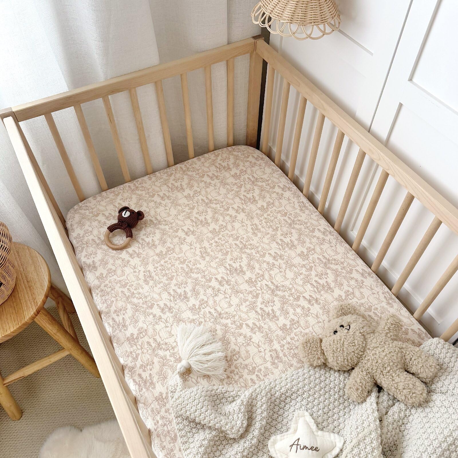 BuLuTu crib sheet 8-pocket fit close-up emphasizes secure 360-degree elastic.