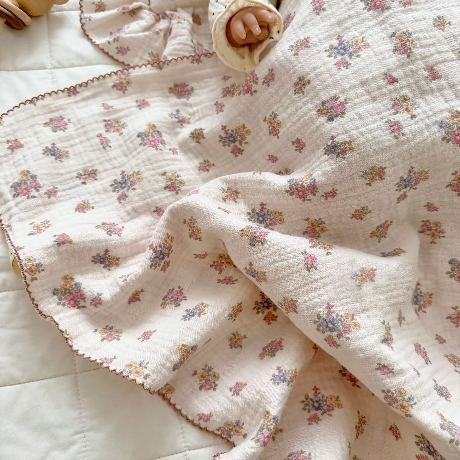 BuLuTu Muslin Cotton Baby Blanket with lace border emphasizes gender-neutral design for any nursery.