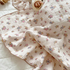 BuLuTu Muslin Cotton Baby Blanket with lace border emphasizes gender-neutral design for any nursery.