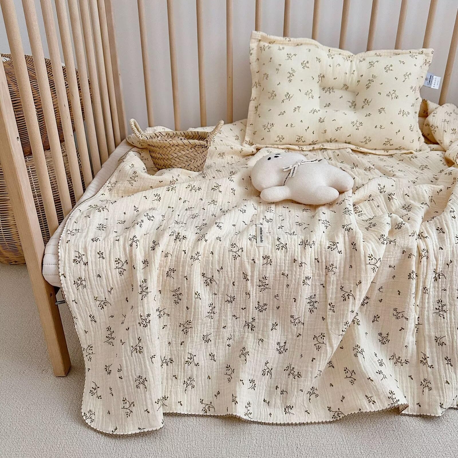BuLuTu muslin blanket on crib, olive pattern, gentle skin-friendly comfort.