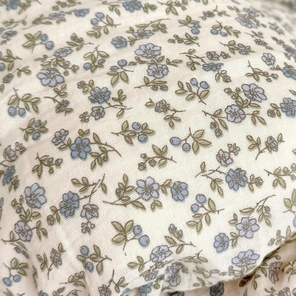 BuLuTu muslin pillowcase for crib features soft blue blossoms.