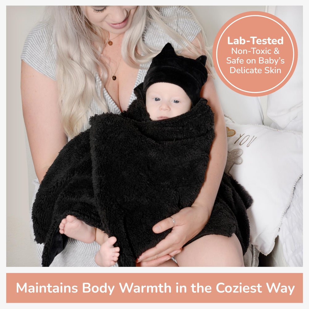 Bumba Kids sherpa fleece double-sided swaddle for all-around softness.