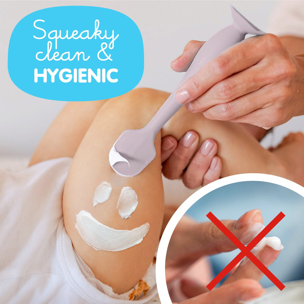Bumco diaper cream spatula with suction base stands upright for mess-free diaper changes.