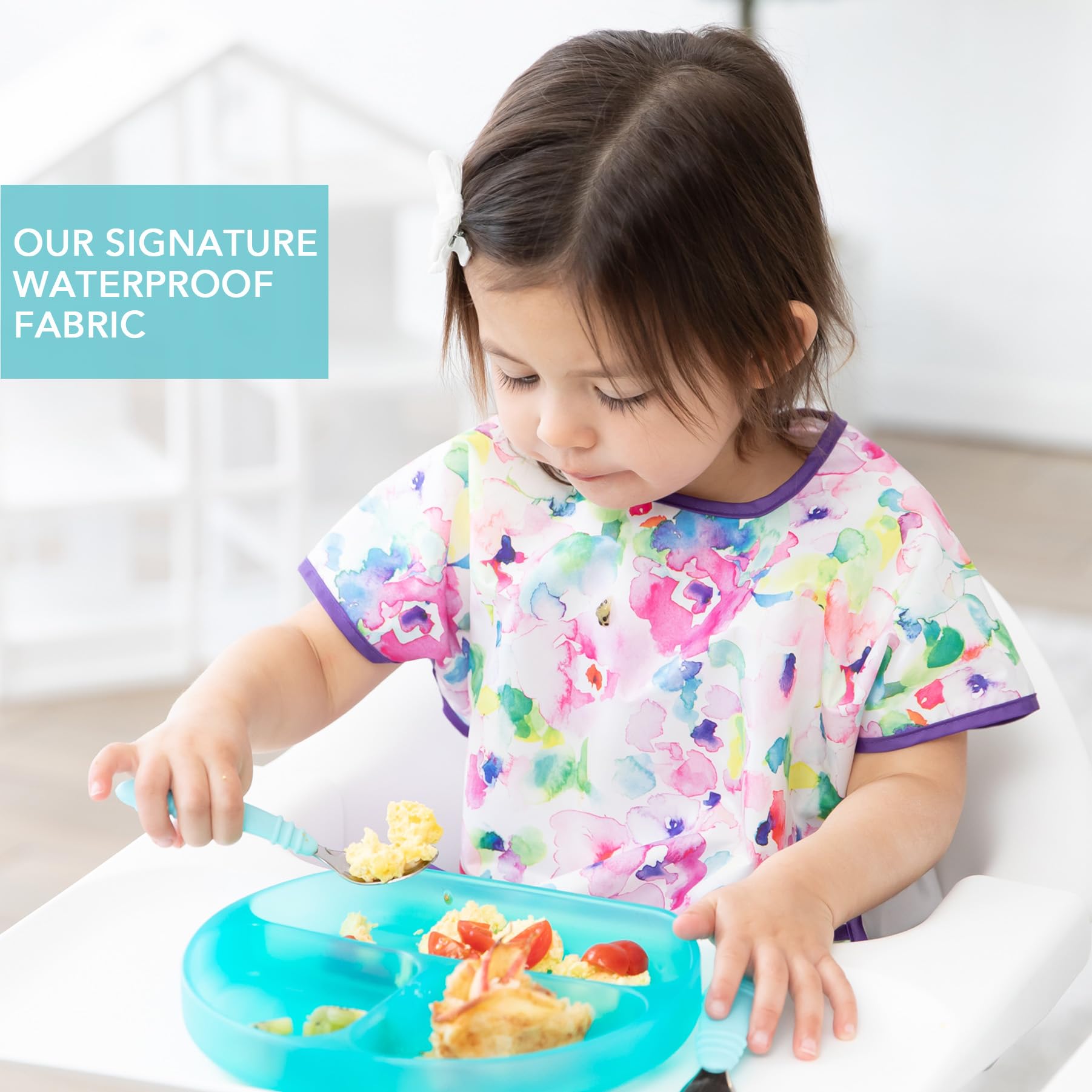 Bumkins bib back-closure provides tug-proof adjustable fit for toddlers.