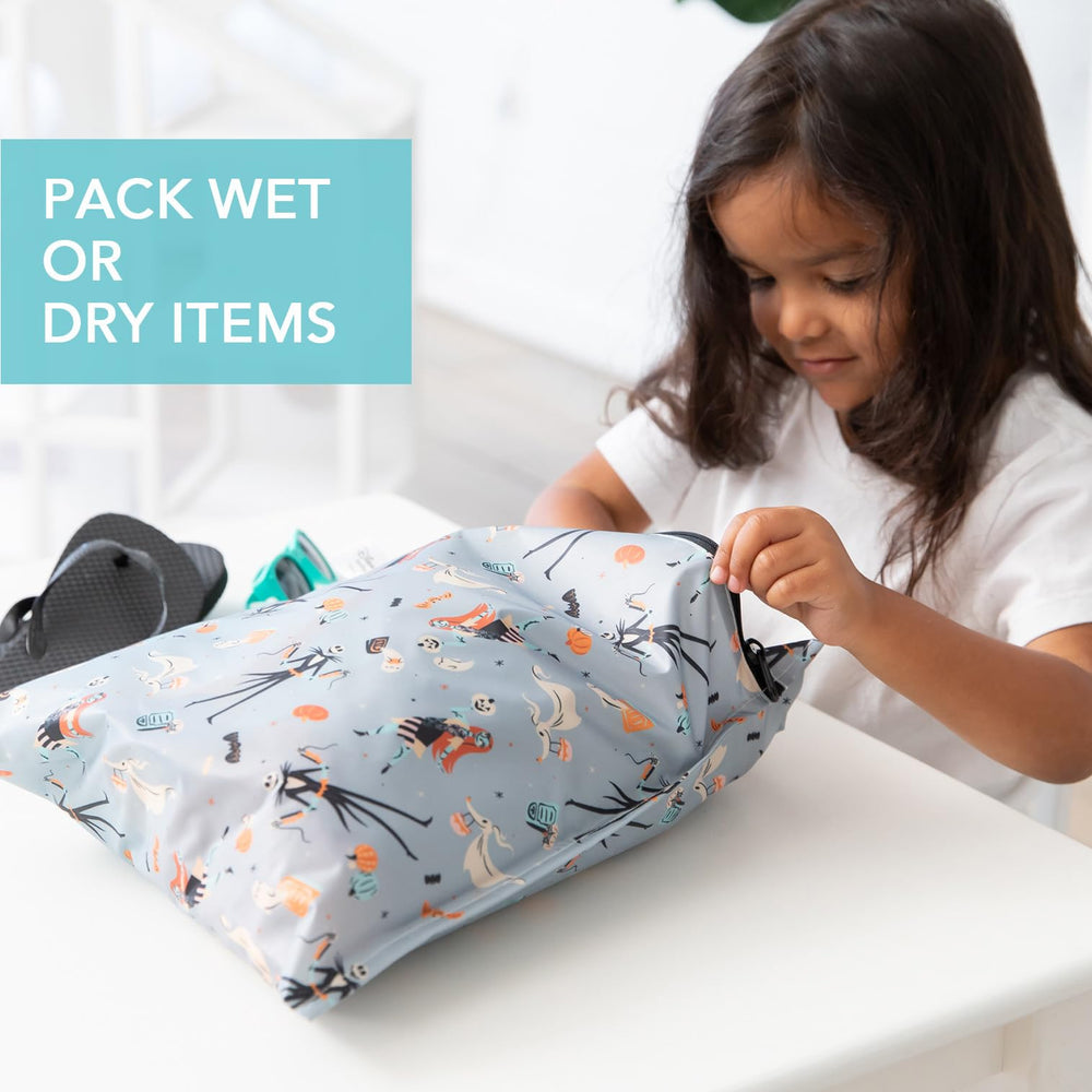 Bumkins Disney wet bag attached to stroller handle for easy travel access
