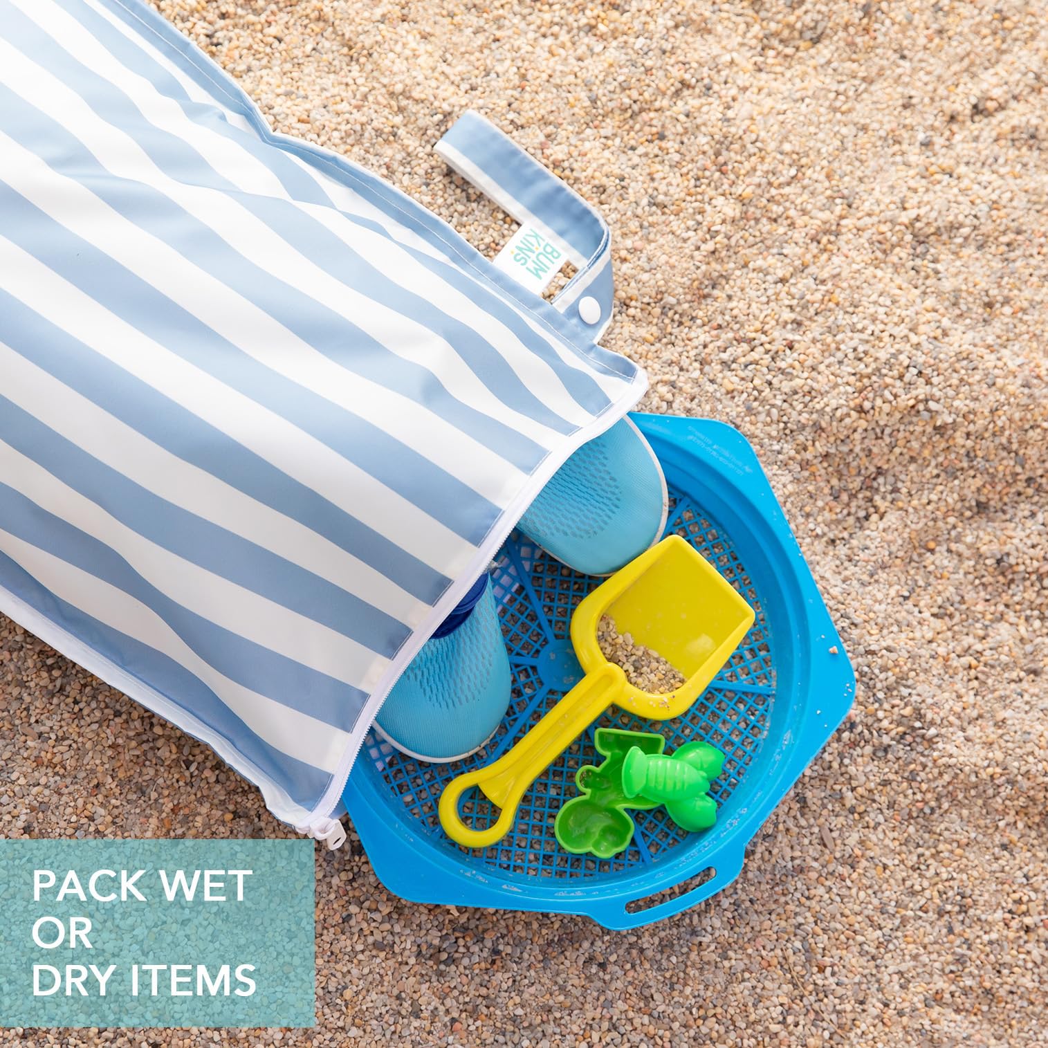 Bumkins wet bag blue stripe shown with contents organized during pool day