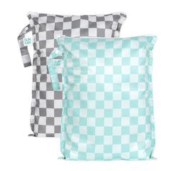 Bumkins larger wet bag gray-check strapped to stroller for travel organization.