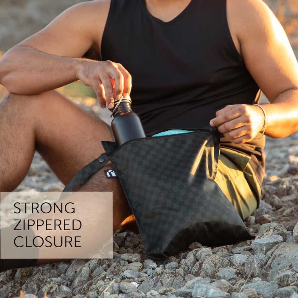 Bumkins Roamio wet bag in off-white demonstrates versatile storage at pool or gym.