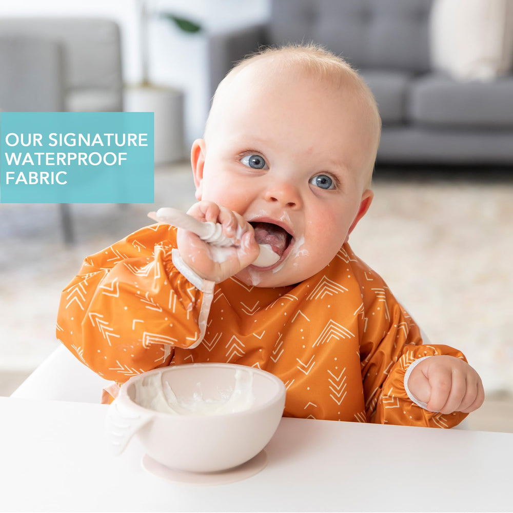 Bumkins Sleeved Bib back-tie closure secures fit during meals.