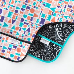 Bumkins Sleeved Bib is wipe-clean and machine-washable for busy parents.