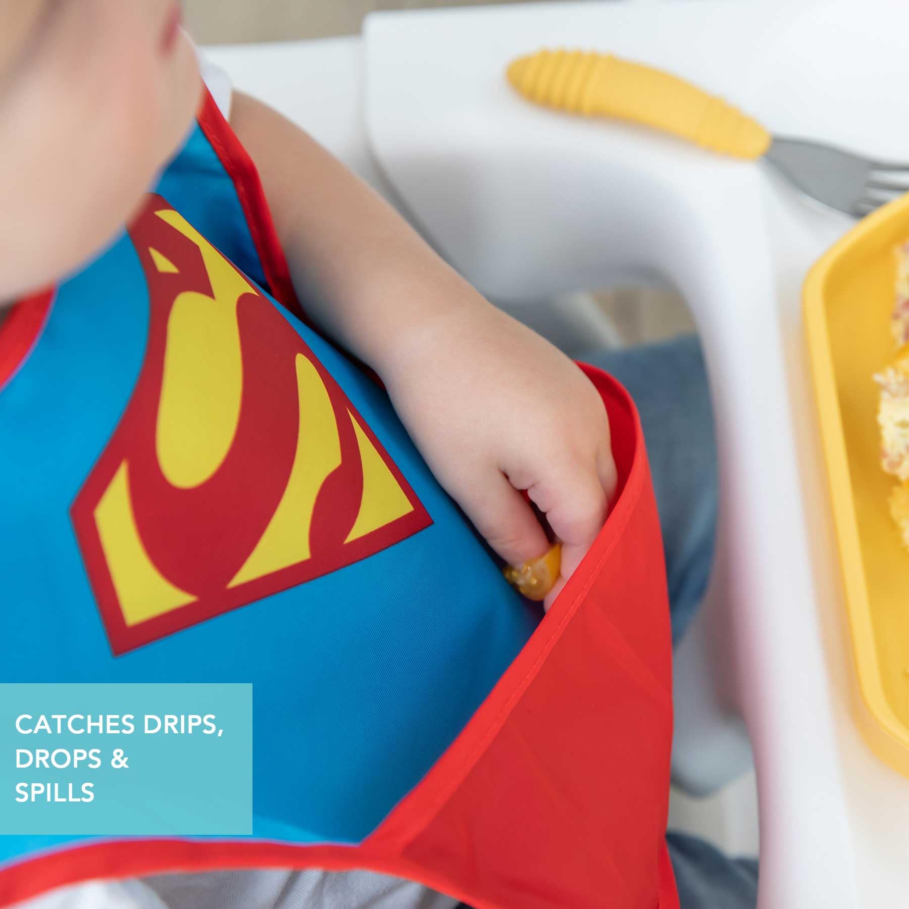 Bumkins SuperBib catch pocket visible for catching crumbs and spills.