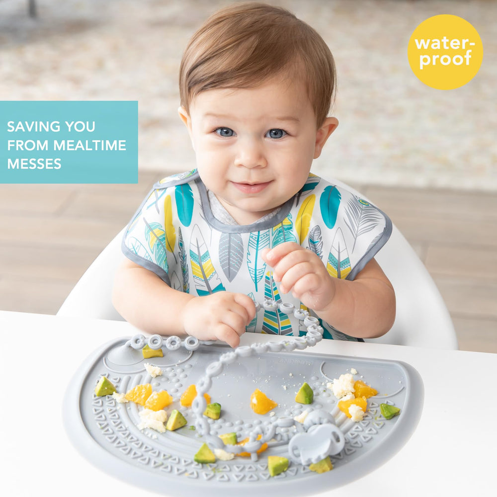 Bumkins SuperBib crumb-catcher pocket collects spills for easier cleanup.