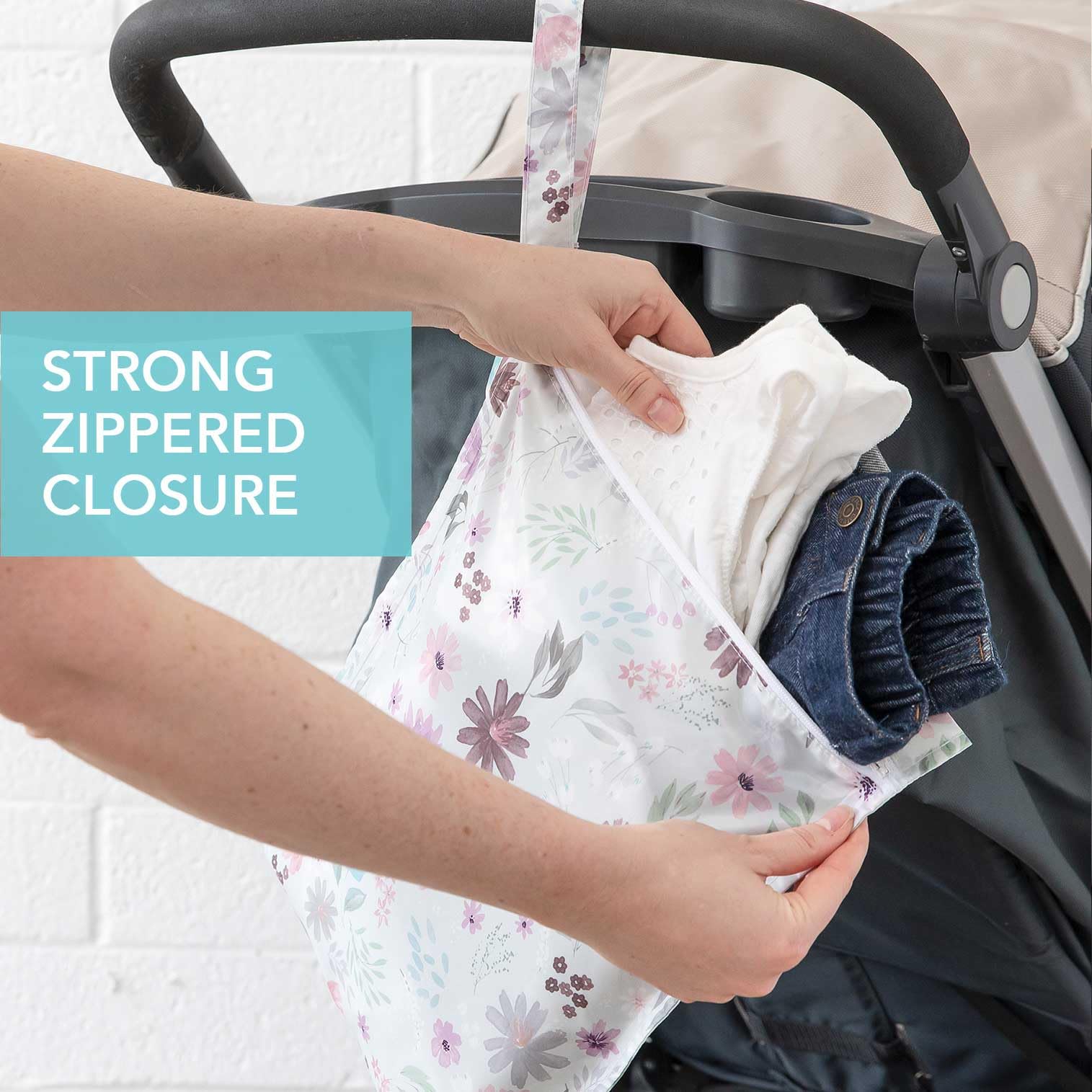 Bumkins Waterproof Wet Bag Floral Lace keeps diaper essentials neatly organized in a bag.