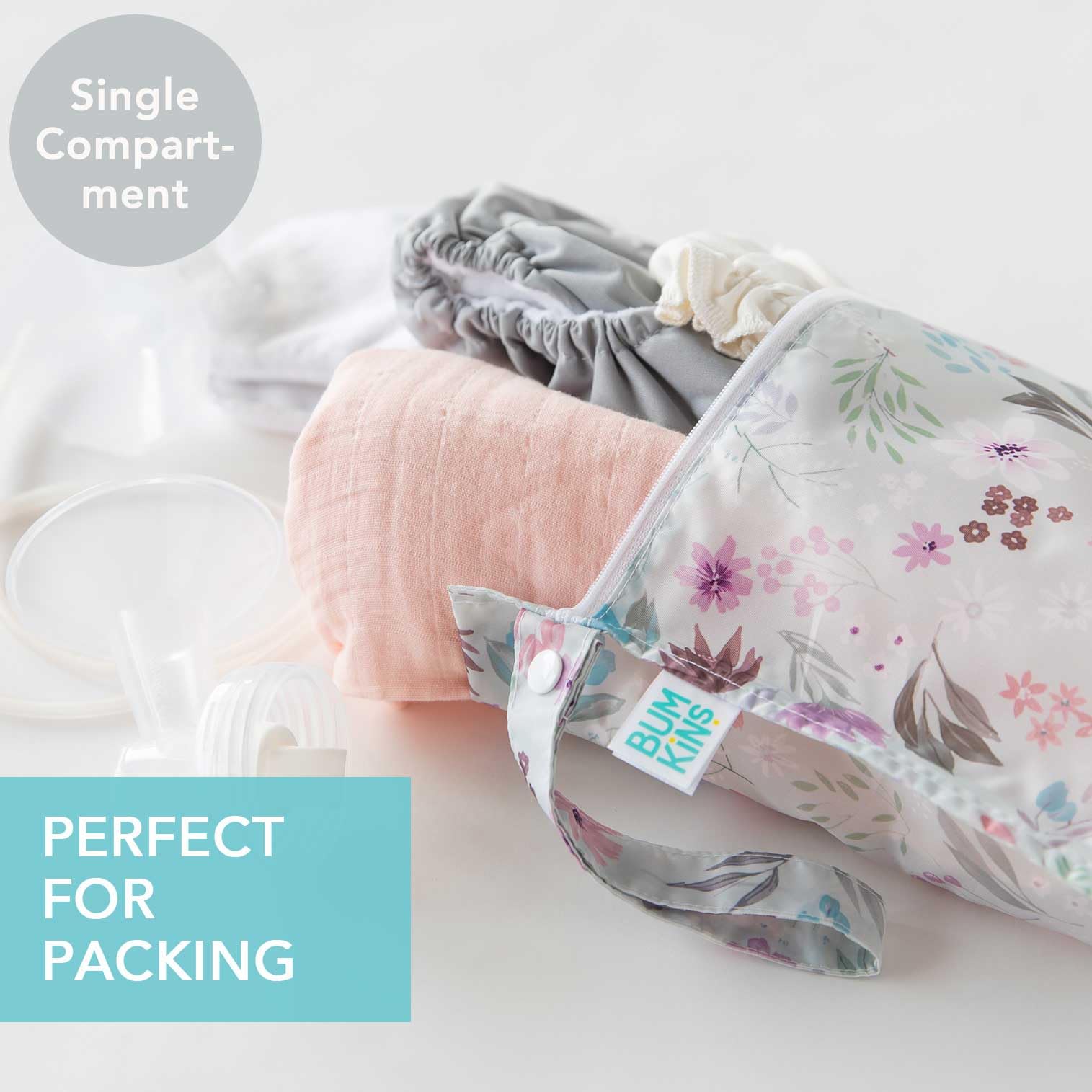 Bumkins Waterproof Wet Bag Floral Lace attached to a stroller for hands-free organization.