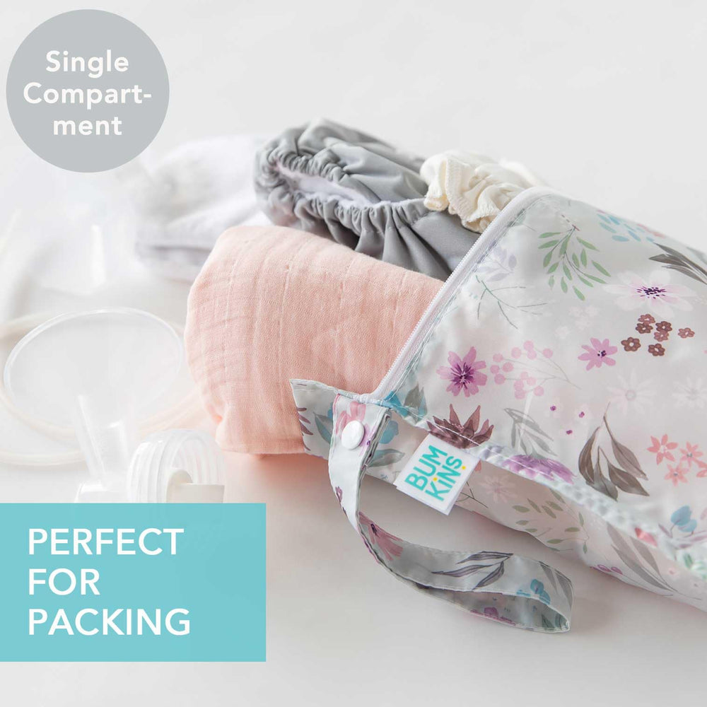 Bumkins Waterproof Wet Bag Floral Lace attached to a stroller for hands-free organization.