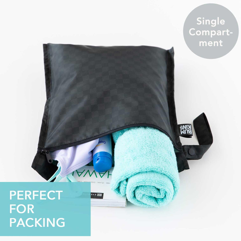 Bumkins waterproof wet-dry clutch closed keeps travel essentials dry on the go.