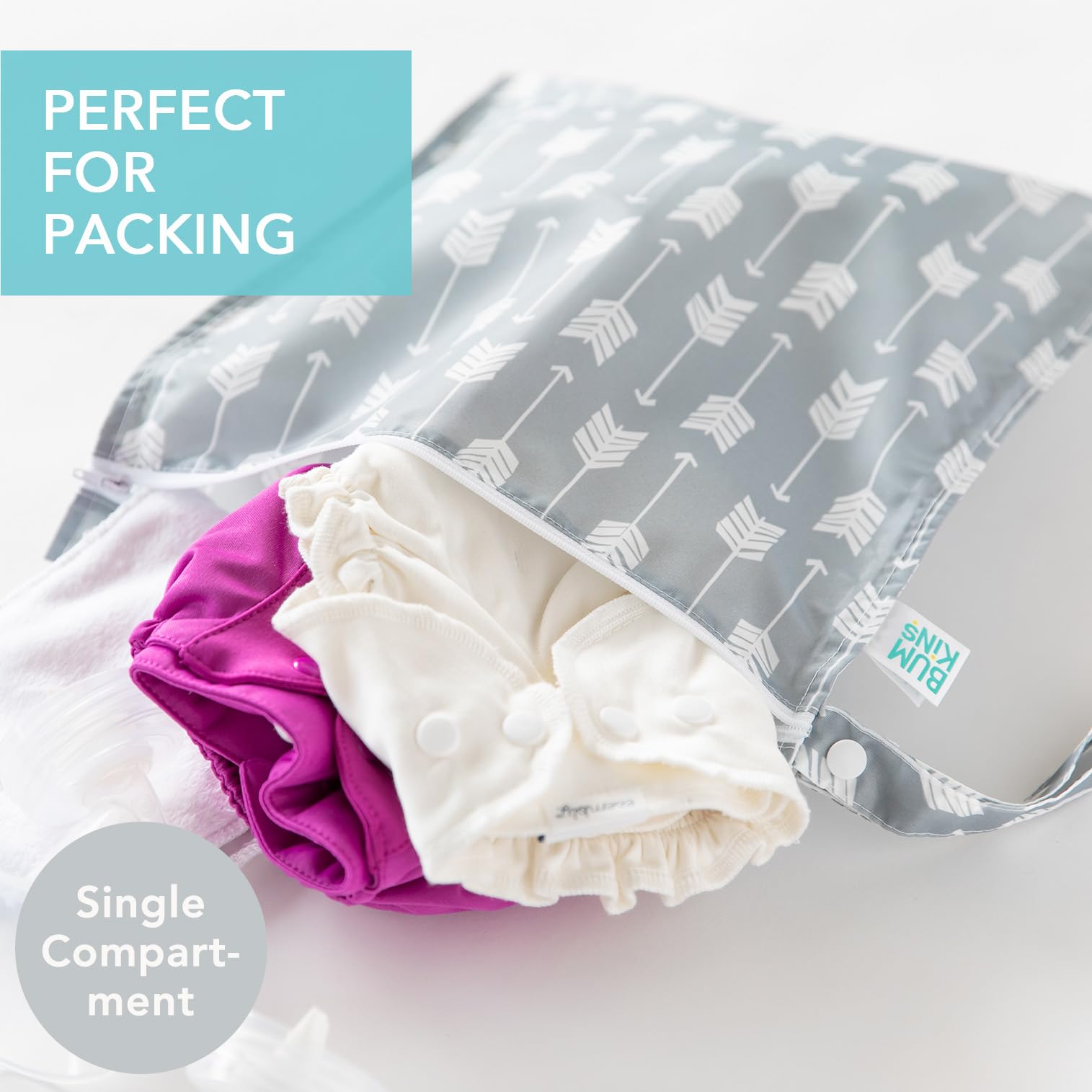 Bumkins wet bag arrows design empty shows packable storage for diapers and toiletries.