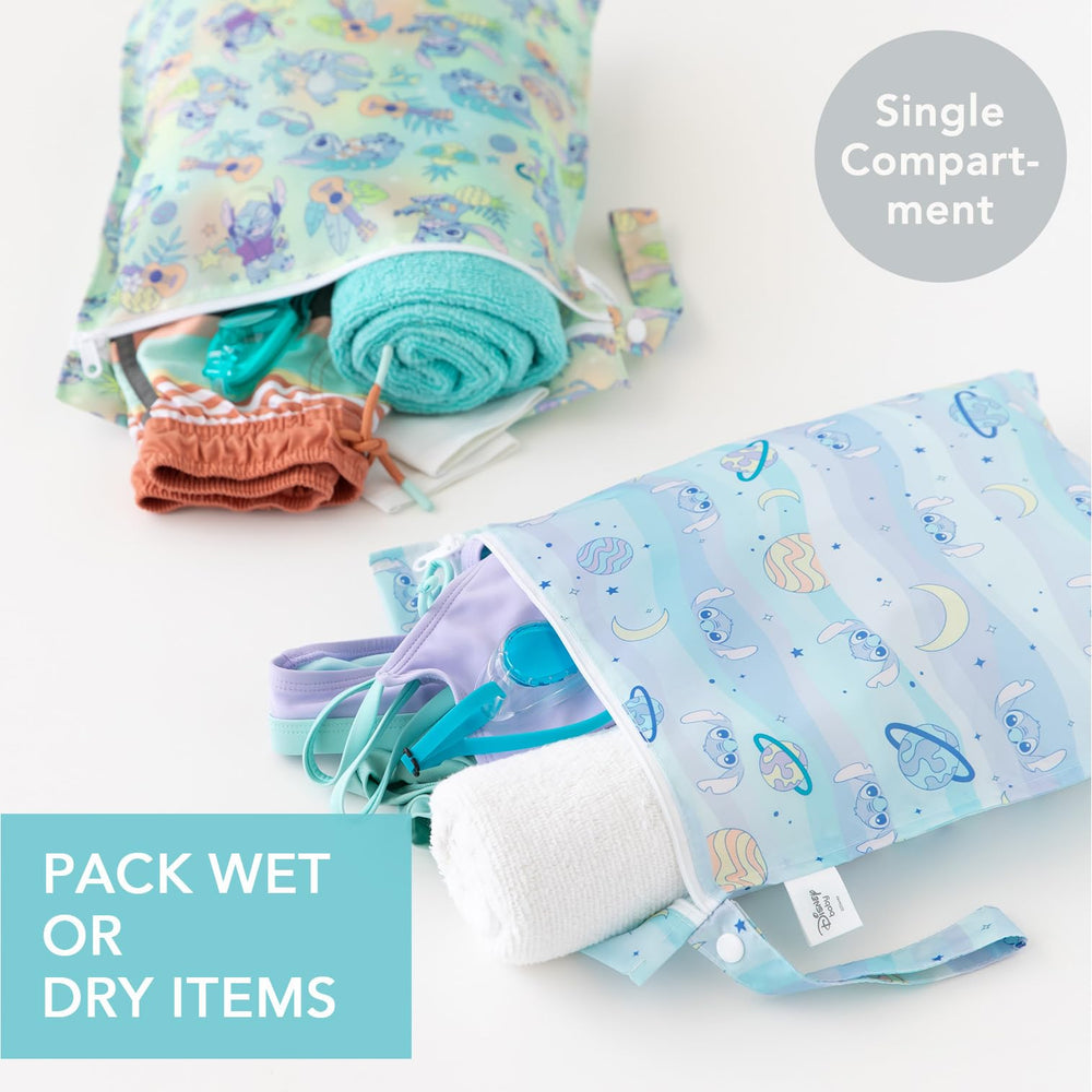 Bumkins wet bag with built-in strap attached to stroller for quick access.