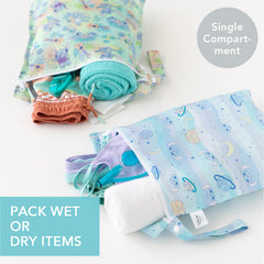 Bumkins wet bag with built-in strap attached to stroller for quick access.